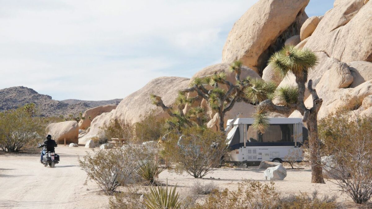 A chopper and an RV at the desert-like Belle Campground