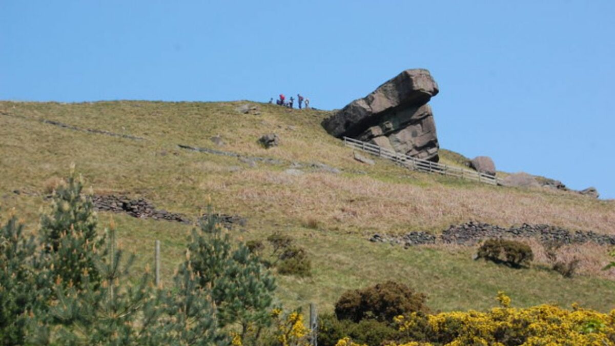 Wild campers and hikers near the hanging stone on Hangingstone Hill