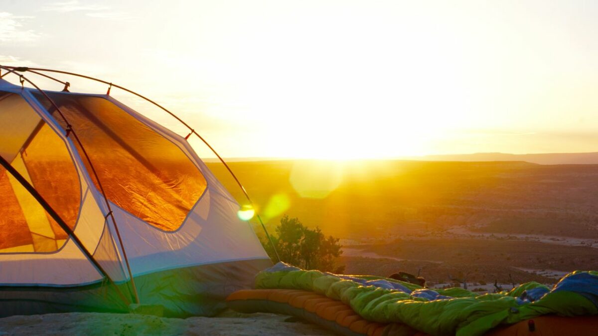 A tent pitched at golden hour