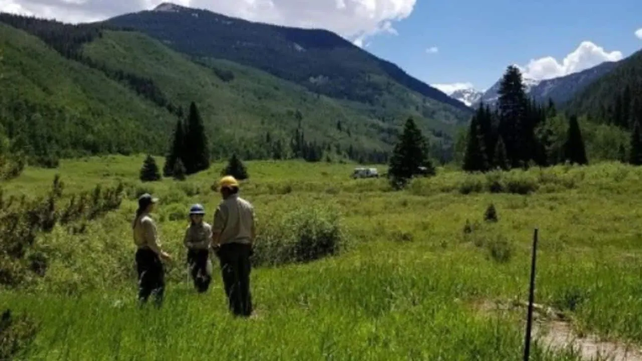 Hikers in Yeoman Park with an RV in the background