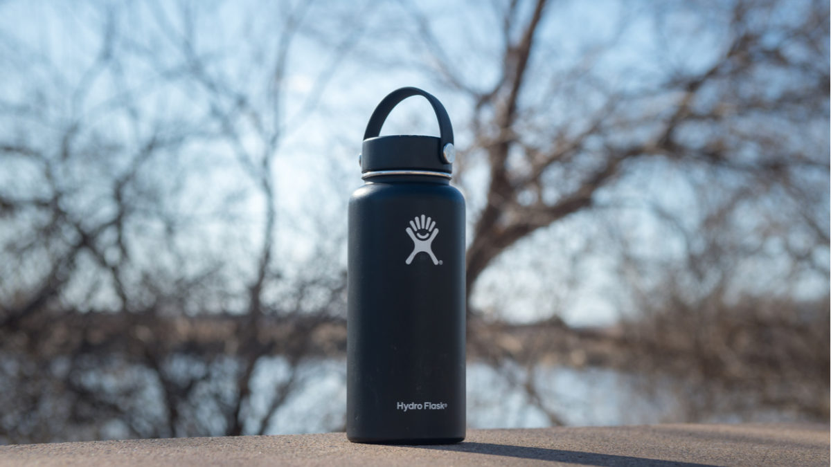 Black Hydro Flask on concrete