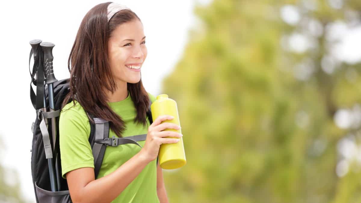 Hiker holds a water bottle
